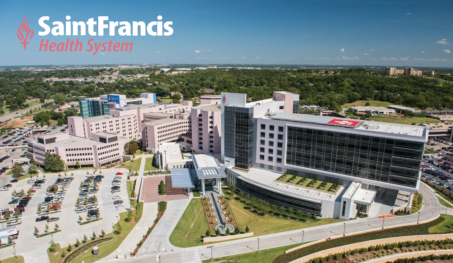 A photo of the Saint Francis main hospital campus. In the sky, the Saint Francis hovers benevolently.